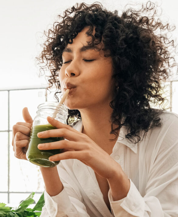 woman sipping smoothie